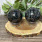 Garnet and Strophiolate Spheres